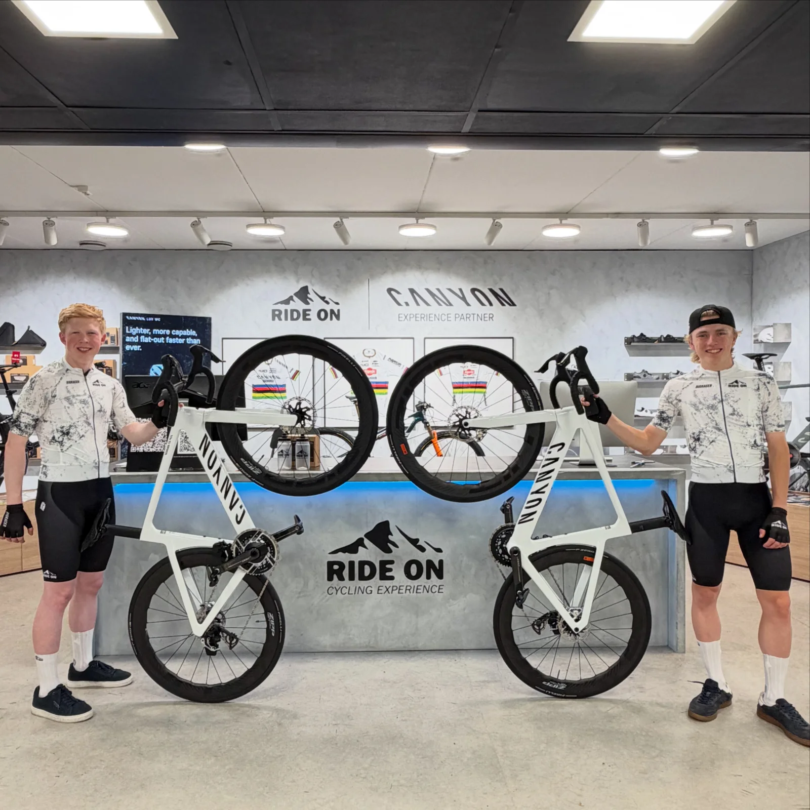 Two cyclists wearing Ride On cycling kit at Ride On in Høvik